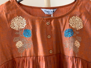 Embroidered peach tunic